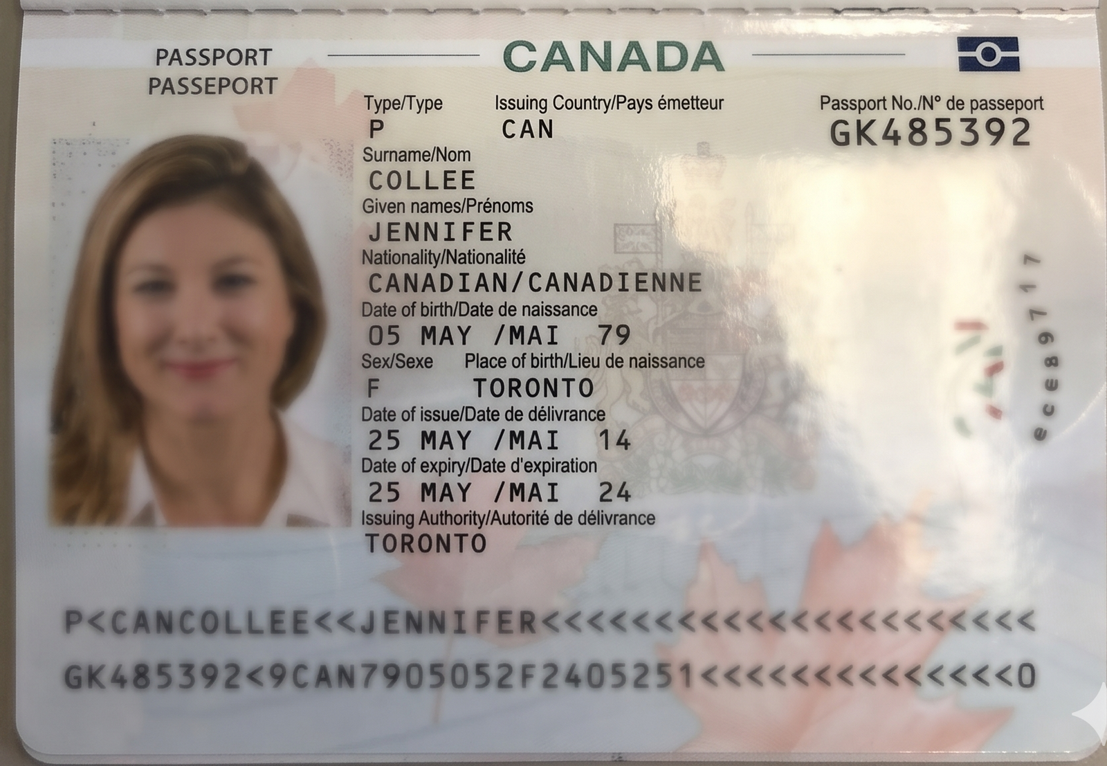 Passport photo page with glare covering the passport number